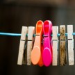 Clothes line with colourful pegs