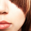 Cropped image of an attractive female with a creative hairstyle